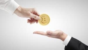 hand giving bitcoin