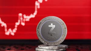 Eine Zcash-Münze vor einem roten Chart.