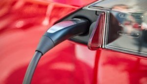 electric car charging process by power cable supply plugged in.