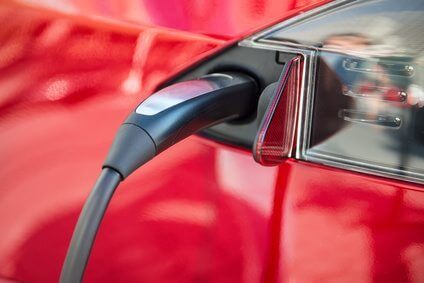 electric car charging process by power cable supply plugged in.