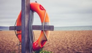 Life buoy on post at the beach