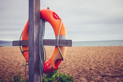 Life buoy on post at the beach