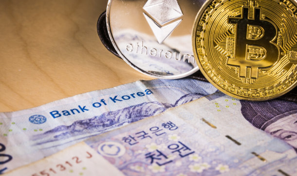 Südkoreanisches Schwergewicht investiert in Krypto-Start-up CrossAngle Südkoreanische Banknote neben Bitcoin und Ethereum.