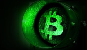 eine grüne ampel mit einem bitcoin-symbol