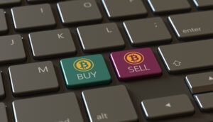 Eine tastatur mit zwei bitcoin-symbolen: einmal "buy" in grün und einmal "sell" in rot