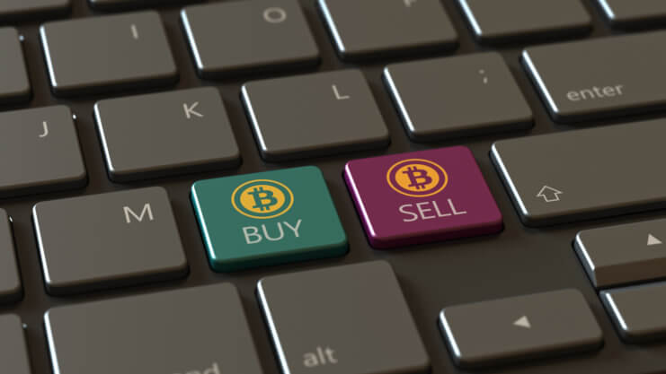Eine tastatur mit zwei bitcoin-symbolen: einmal "buy" in grün und einmal "sell" in rot
