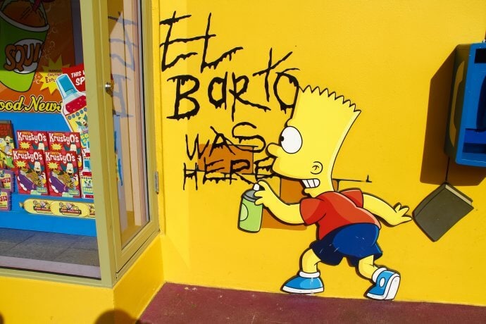 bart simpson sprüht auf eine gelbe wand mit schwarzem lack sein tag 