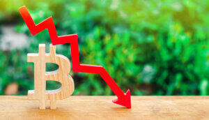 ein bitcoin-symbol mit einem roten chart