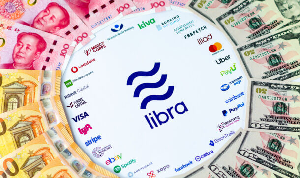 Bankenschreck: Bankenverband sucht europäische Antwort auf Libra 2.0 Libra-Logo umringt von Banknoten in US-Dollar, Euro und Remnibi