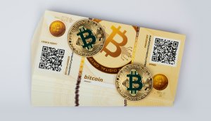 Bitcoin Paper Wallets und zwei physische Bitcoin-Münzen