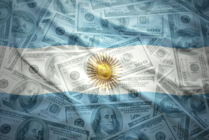 colorful waving argentinean flag on a american dollar money background