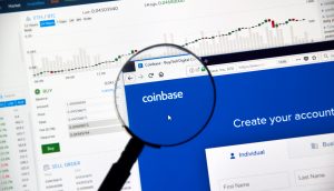 Coinbase cryptocurrency exchange website under magnifying glass