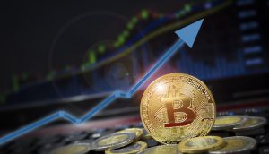 bitcoin-münze vor einer chart