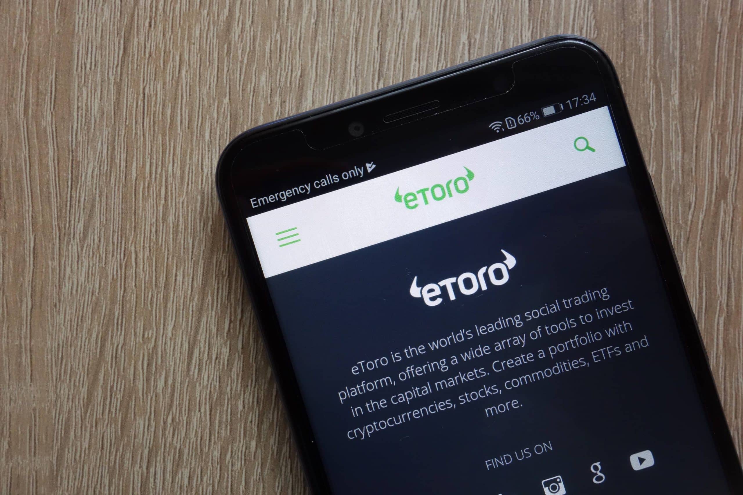 Smartphone mit eToro-Logo