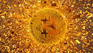 Bitcoin Münze und Goldsplitter
