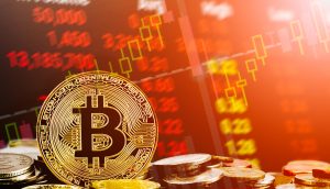 Bitcoin-Münze vor einem Chart