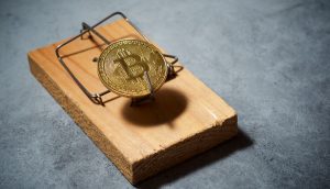 Bitcoin-Münze als Köder einer Mausefalle