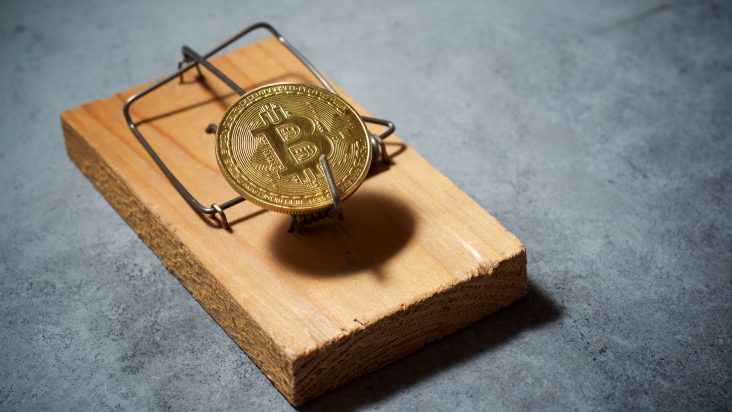 Bitcoin-Münze als Köder einer Mausefalle