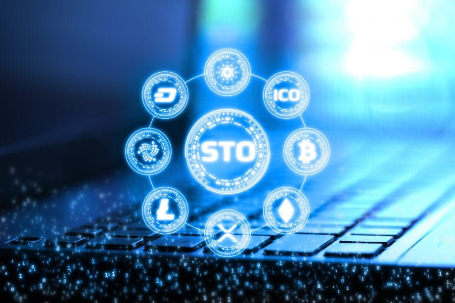 STO-Konsortium um area2invest veröffentlicht Whitepaper-Serie STO steht in der Mitte des Bildschirms. Drumherum sind verschiedene Kryptowährungen.