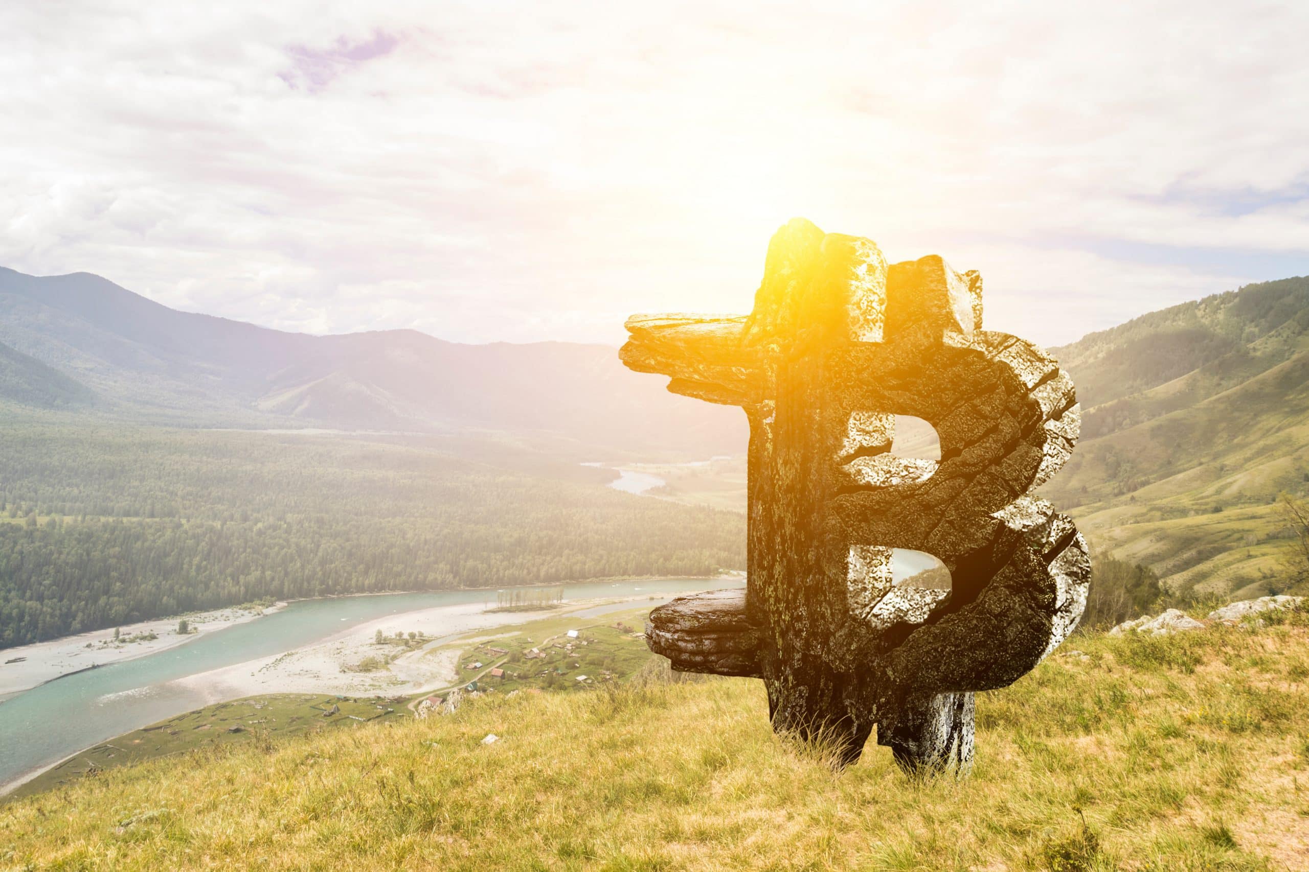 Bitcoin-Logo in Landschaft