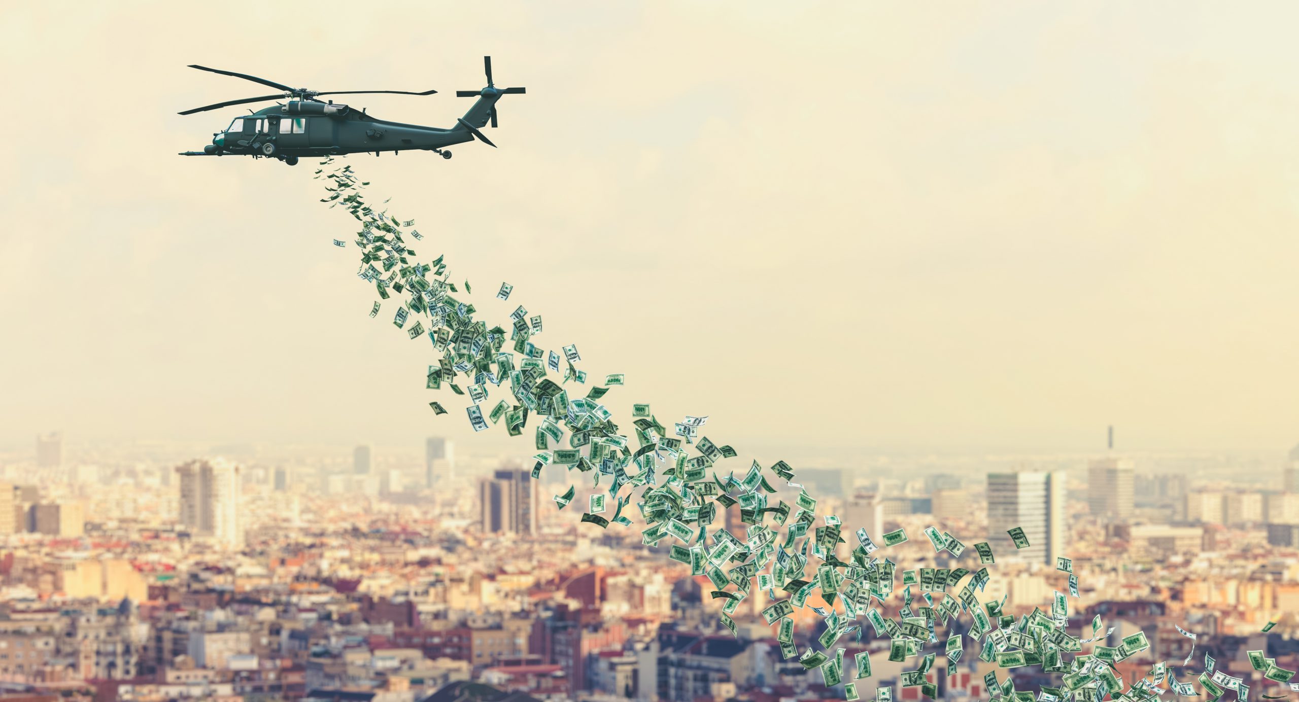 Ein Helikopter verstreut Geld über einer Stadt.