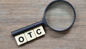 Die Buchstaben OTC und Lupe