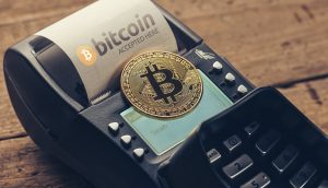 Kartenlesegerät mit Bitcoin-Münze