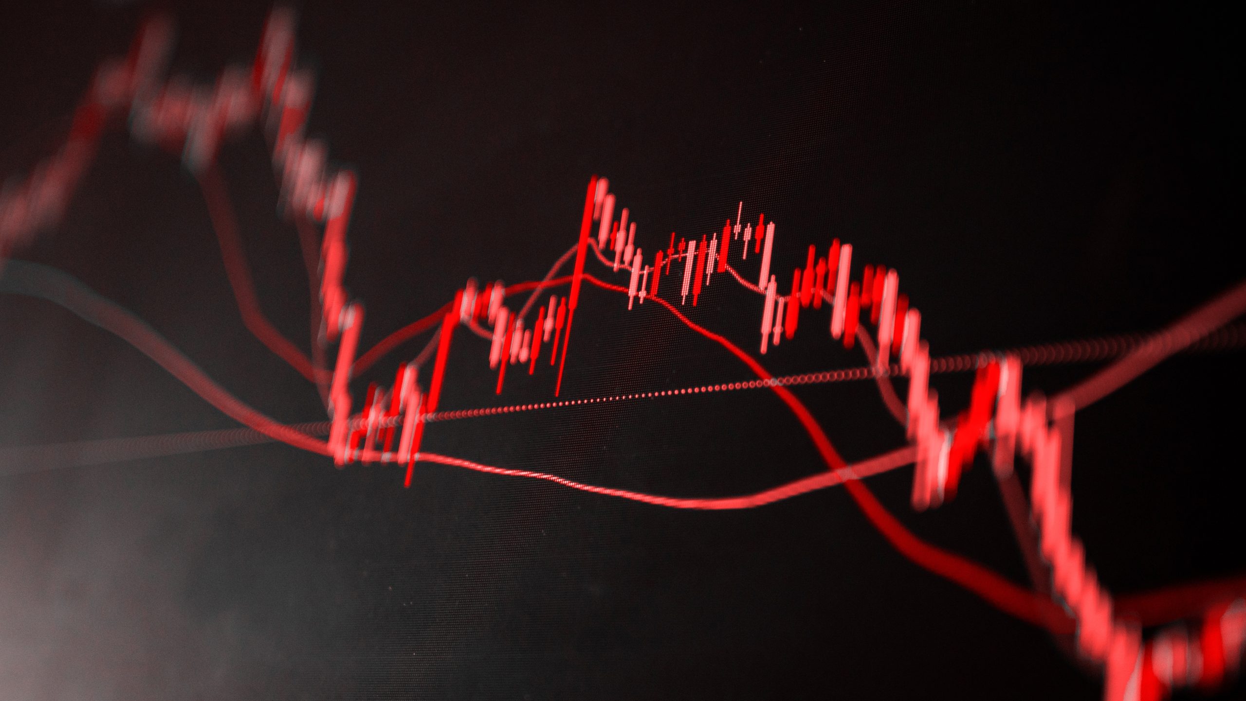 Ein rotes Liniendiagramm auf dunklem Hintergrund zeigt schwankende Datenpunkte und spiegelt die volatile Natur von Altcoins mit ihren Auf- und Abwärtstrends wider.