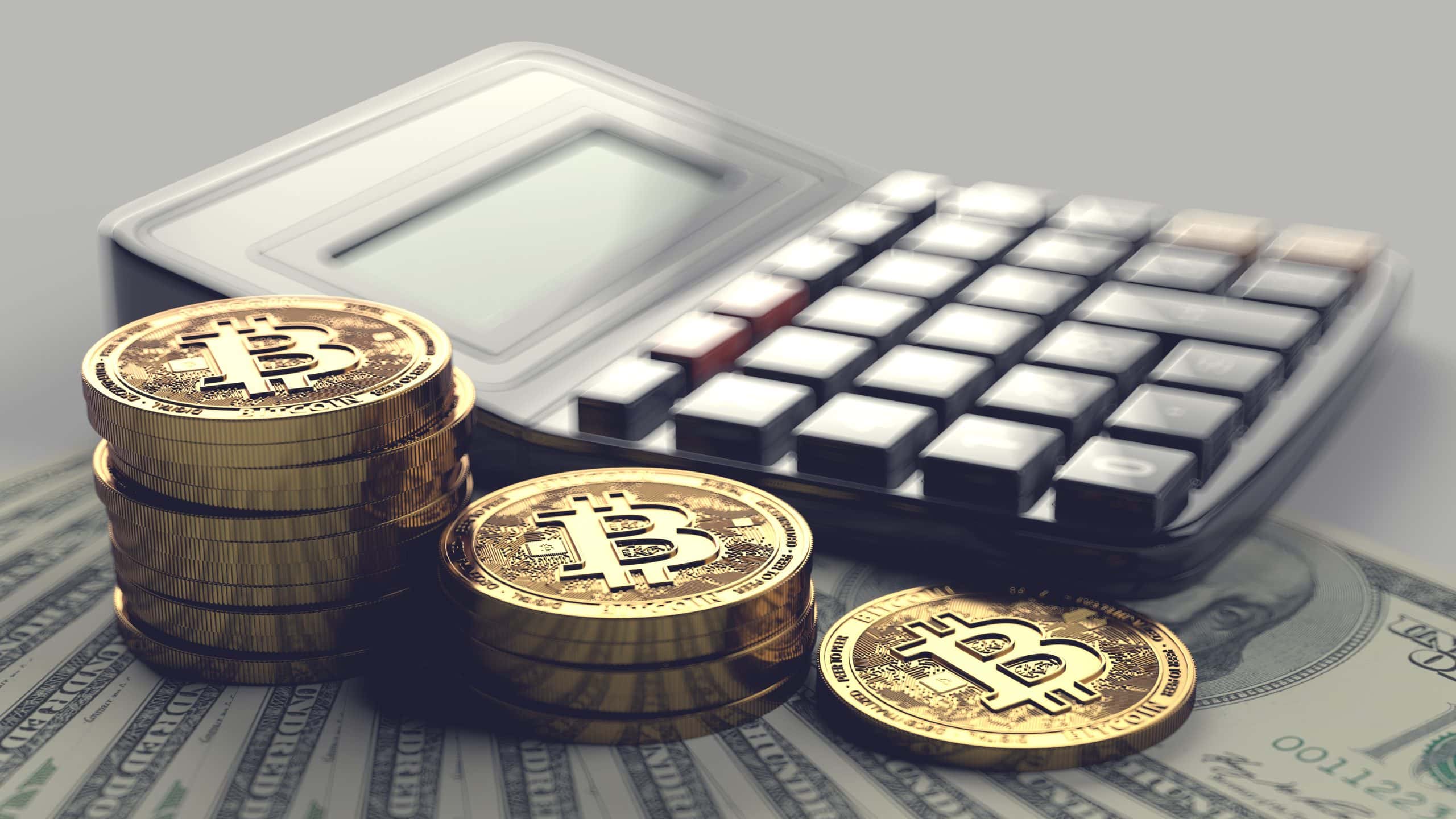 Bitcoin-Münzen und ein Taschenrechner