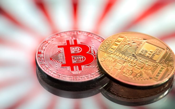 Zwei physische Münzen mit dem Bitcoin-Symbol liegen auf einer reflektierenden Oberfläche vor einem markanten Hintergrund aus rot-weißen Radiallinien. Dieses Bild fängt die Essenz der kühnen Vision von Metaplanet perfekt ein, die sich in ihrem jüngsten 68-Millionen-US-Dollar-Projekt widerspiegelt.
