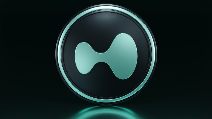 Das kreisförmige, blaugrüne und schwarze Hyperliquid Emblem steht vor einem dunklen Hintergrund