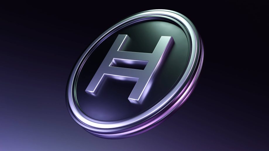 Eine in 3D gerenderte Münze zeigt in der Mitte einen markanten Großbuchstaben H, der für die Kryptowährung Hedera steht.