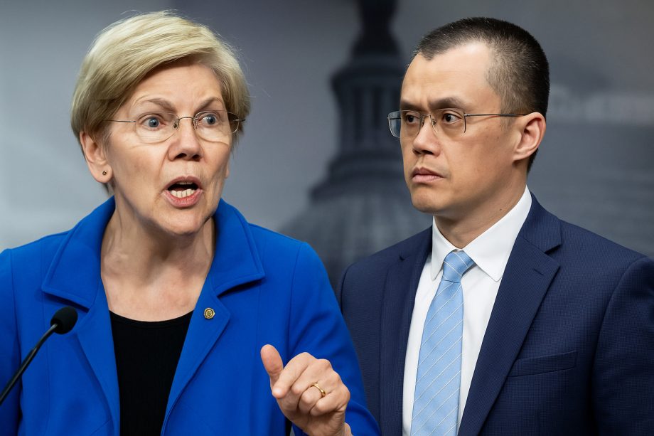 Eine Frau in einem blauen Blazer spricht an einem Podium, während CZ, in einem Anzug und mit Brille, neben ihr steht, beide vor einem unscharfen Hintergrund.