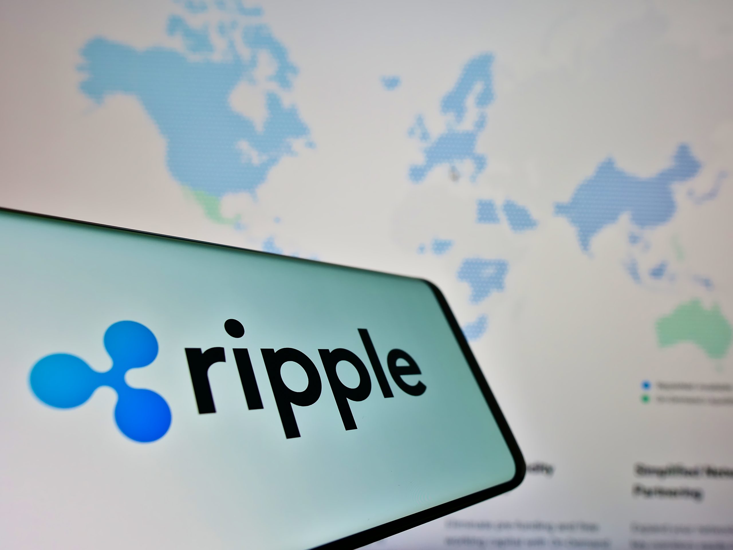 Die Grafik zeigt das Ripple Logo auf einem Smartphone