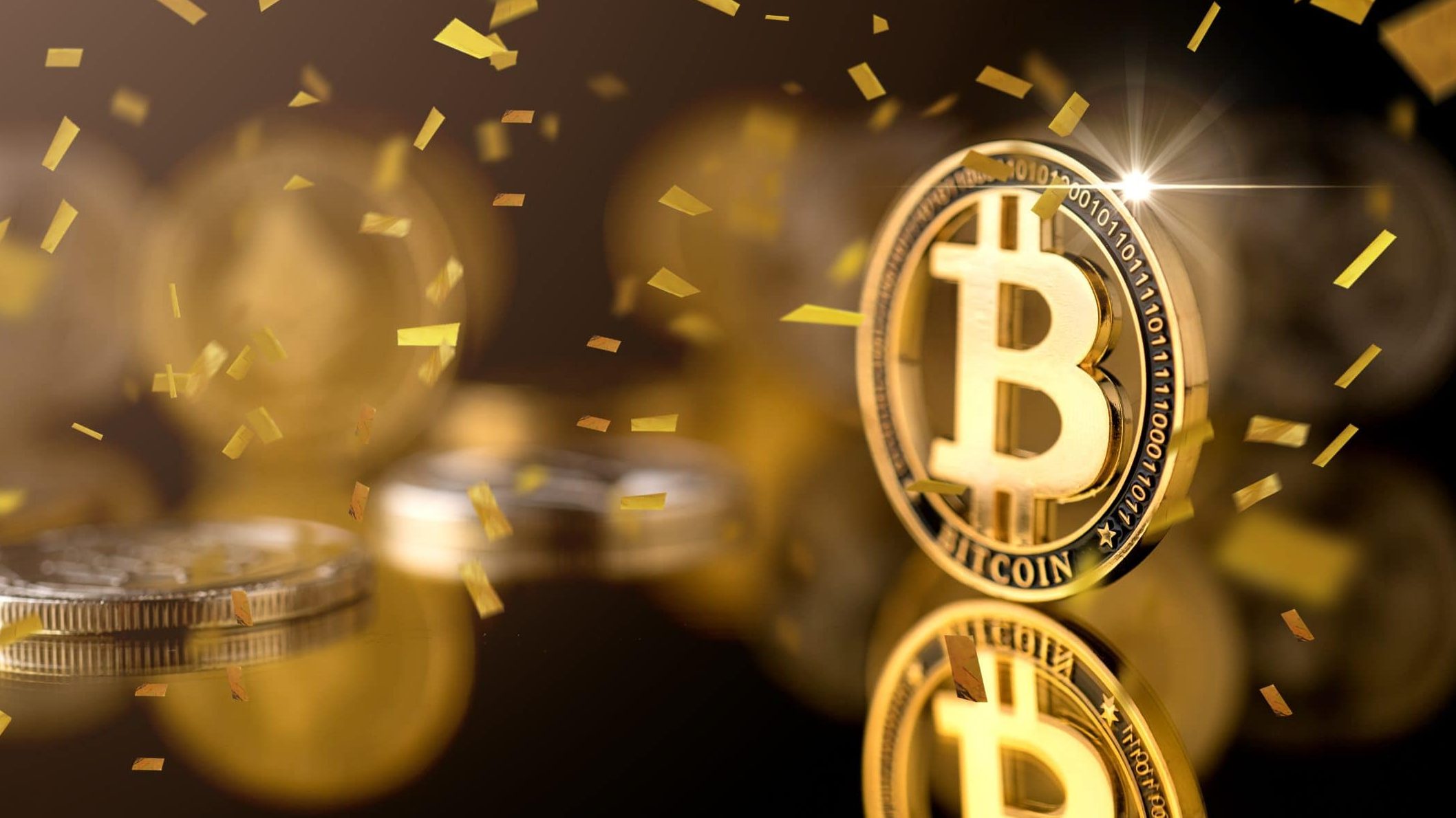 Bitcoin-Münze und Konfetti