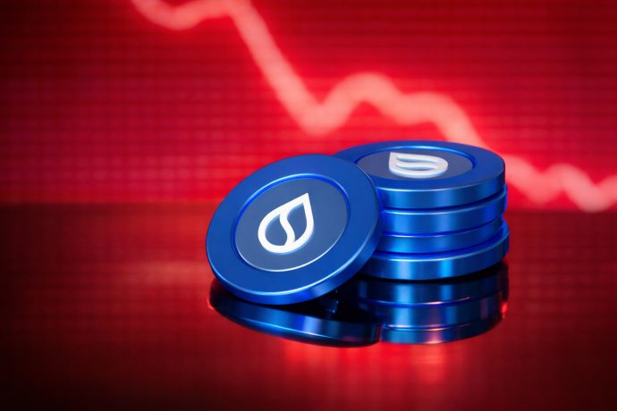 Ein Stapel SUI-Münzen vor einem roten Kurschart