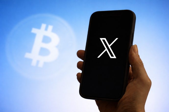 Bitcoin und ein Smartphone mit X
