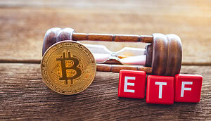 Das Bild zeigt eine Bitcoin-Münze und eine Sanduhr