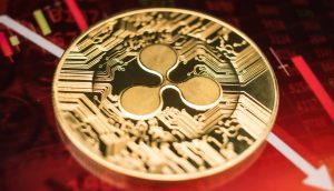 XRÜ-Münze vor fallendem Kurs