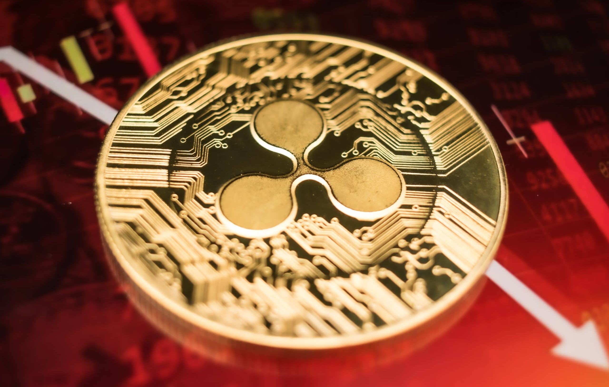 XRÜ-Münze vor fallendem Kurs