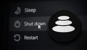 Das Balancer-Logo auf vor einem Computer-Menü, dass ein Herunterfahren-Symbol zeigt