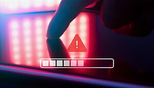 Ein Finger auf einem Laptop