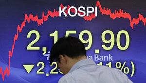 Trader steht vor Anzeige mit Kospi-Index