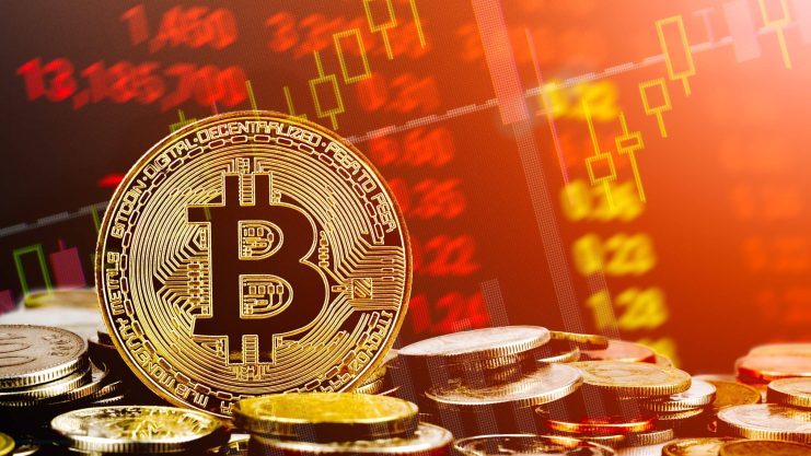 Bitcoin-Münze vor rotem Chartbild