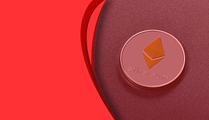 Das Bild zeigt eine Ethereum-Münze auf rotem Hintergrund.