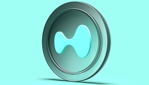 Ein stilisiertes, türkisfarbenes Coin-Logo von Hyperliquid ist vor einem einfarbigen Hintergrund zu sehen.