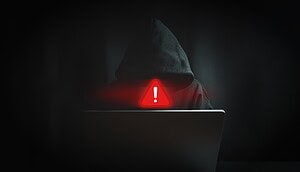 Das Bild zeigt einen Hacker