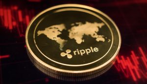 Eine XRP-Münze liegt auf einem roten Kurschart