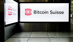 Ein Schild von Bitcoin Suisse