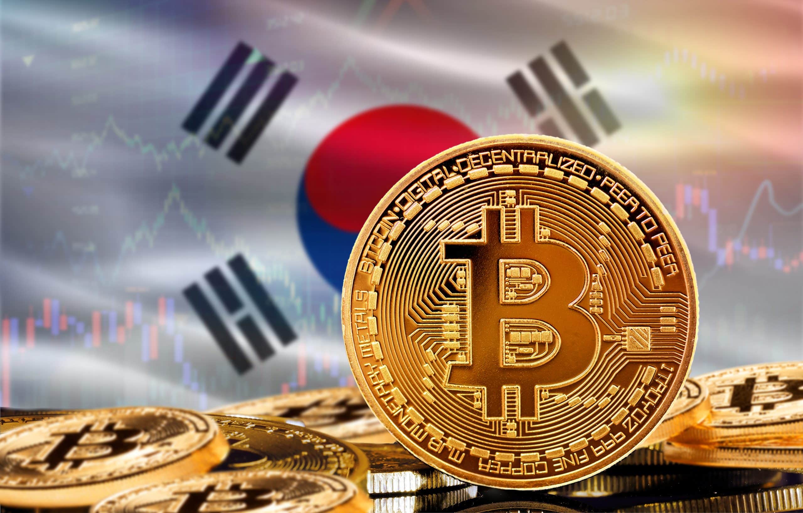 Das Bild zeigt eine Bitcoin-Münze und die südkoreanische Flagge